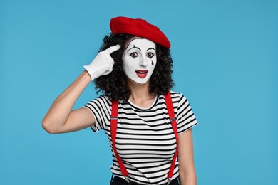 Photo of Funny mine with beret posing on light blue background