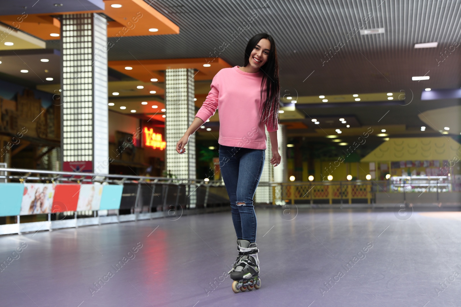 Photo of Young woman spending time at roller skating rink