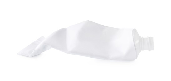 Photo of Crumpled tube of toothpaste isolated on white