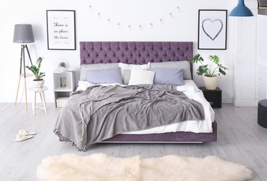 Photo of Bedroom interior with comfortable soft bed