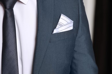 Man with handkerchief in suit pocket, closeup