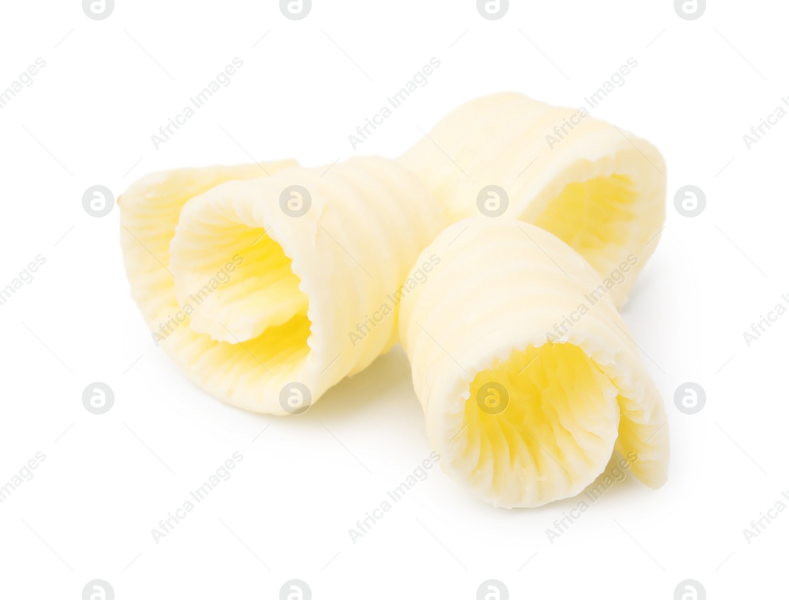 Photo of Fresh tasty butter curls isolated on white