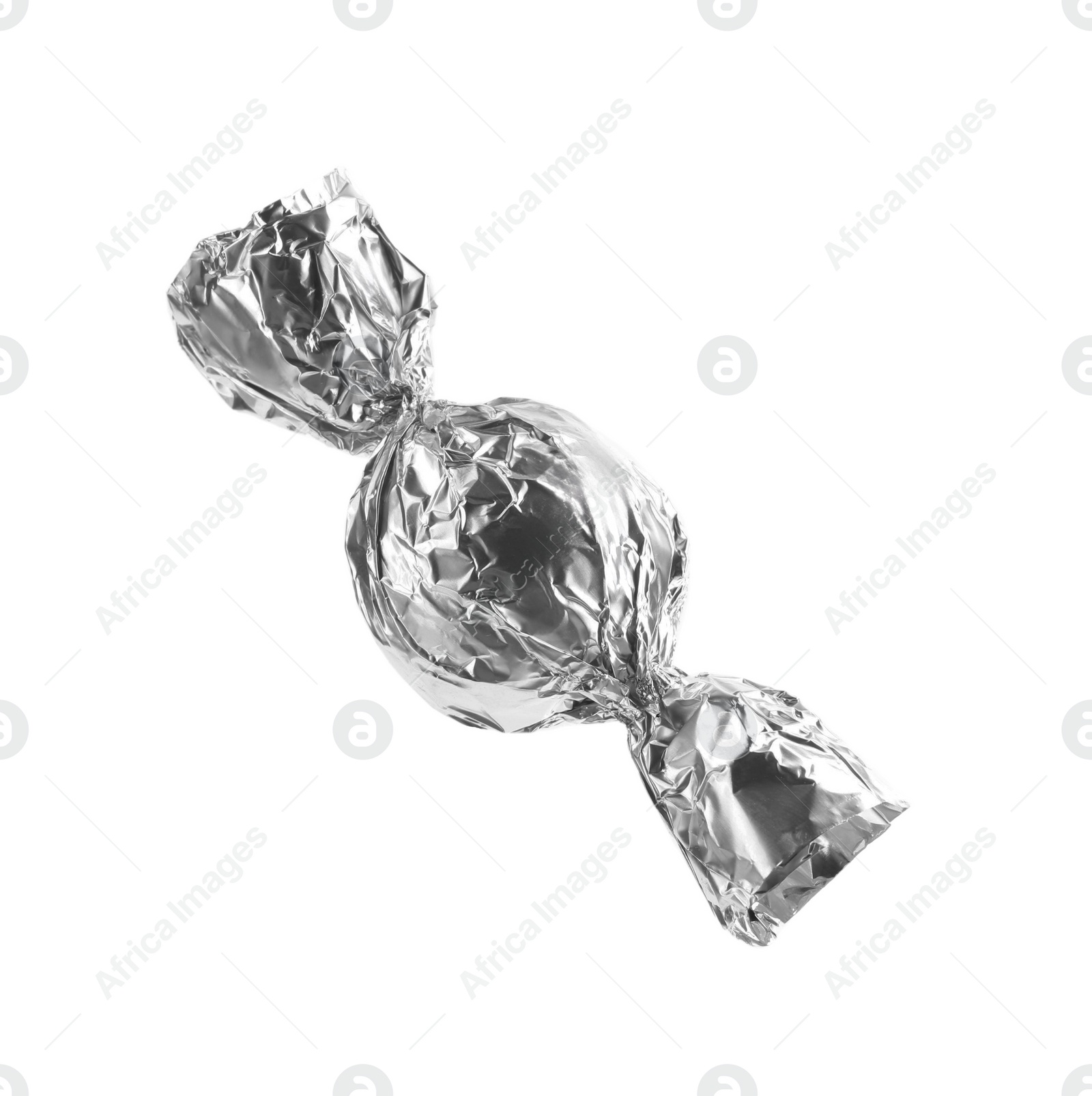 Photo of Tasty candy in silver wrapper isolated on white