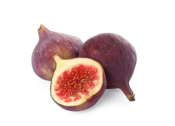 Photo of Whole and cut tasty fresh figs isolated on white