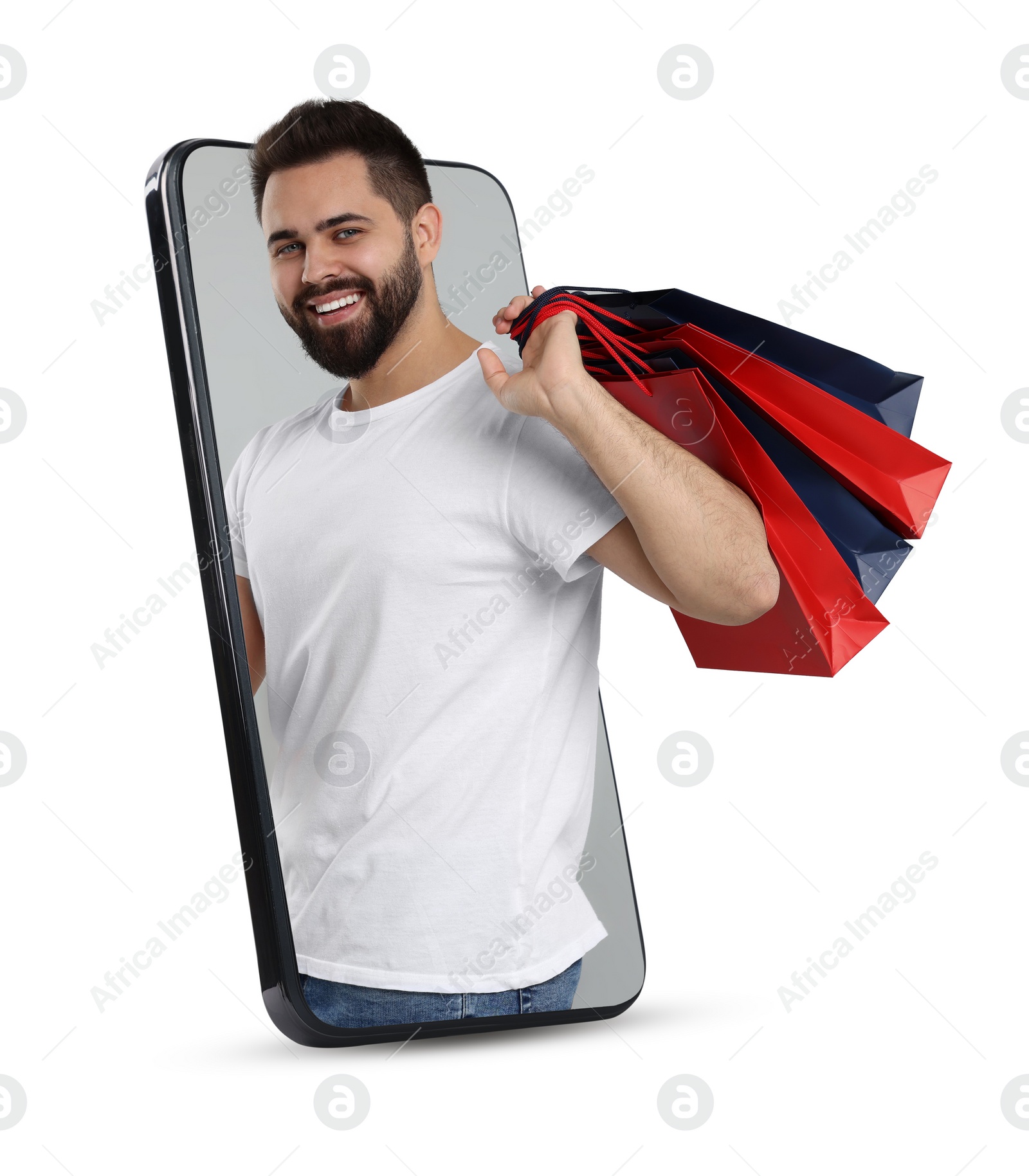 Image of Online shopping. Happy man with paper bags looking out from smartphone on white background