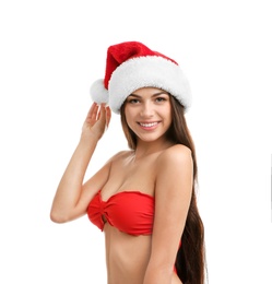 Young beautiful woman in swimsuit and Santa hat on white background. Christmas celebration