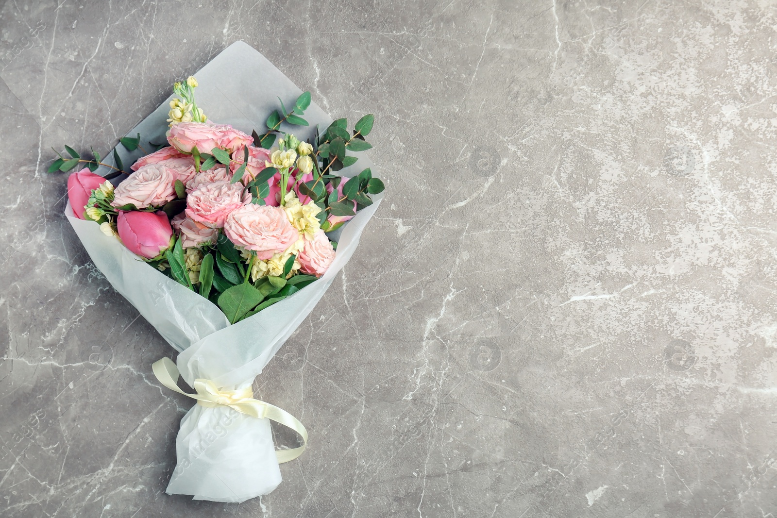 Photo of Bouquet of beautiful fragrant flowers on table