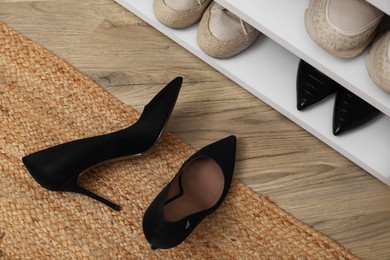 Photo of Stylish female shoes on floor in hall, top view