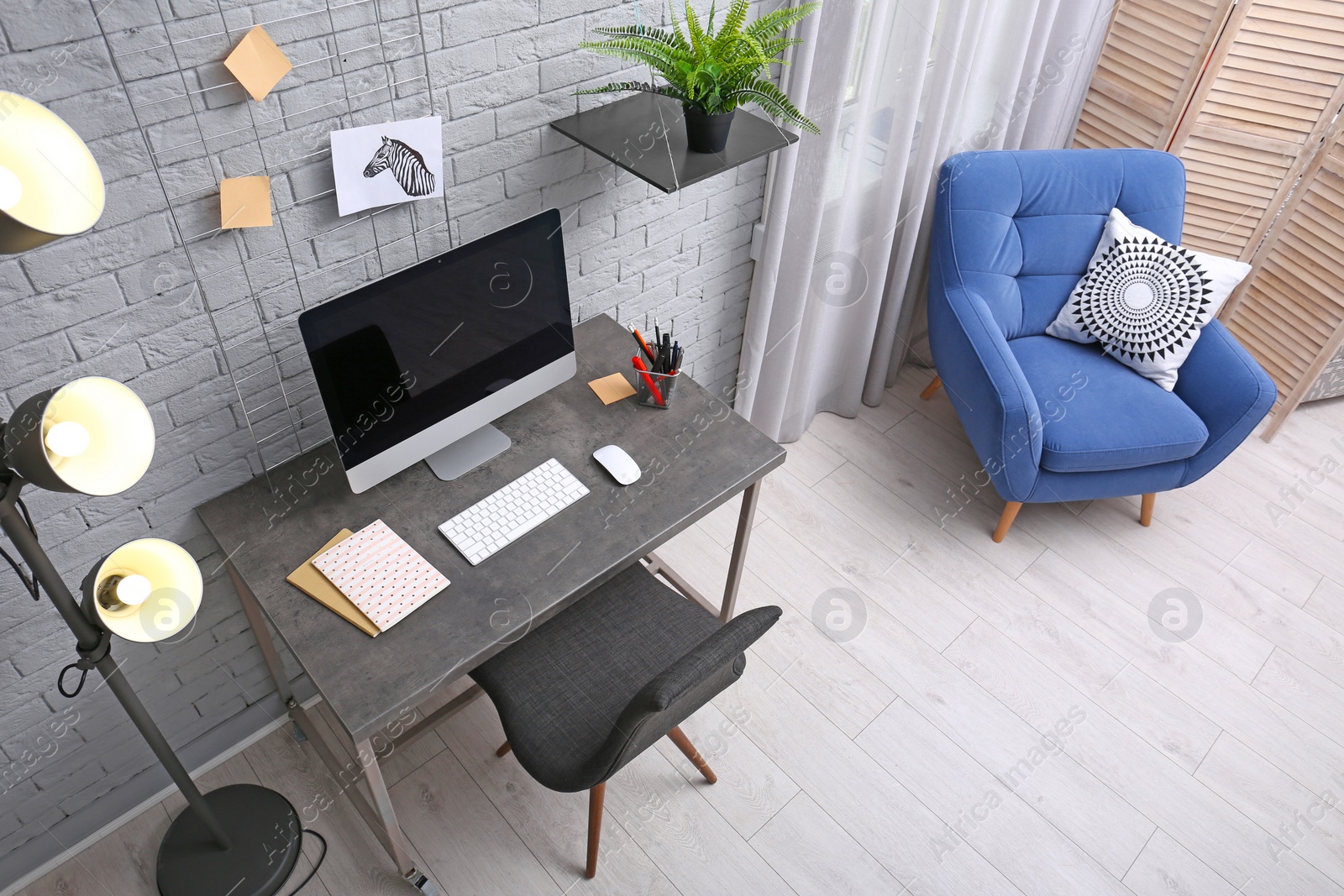 Photo of Modern home office interior, view through CCTV camera