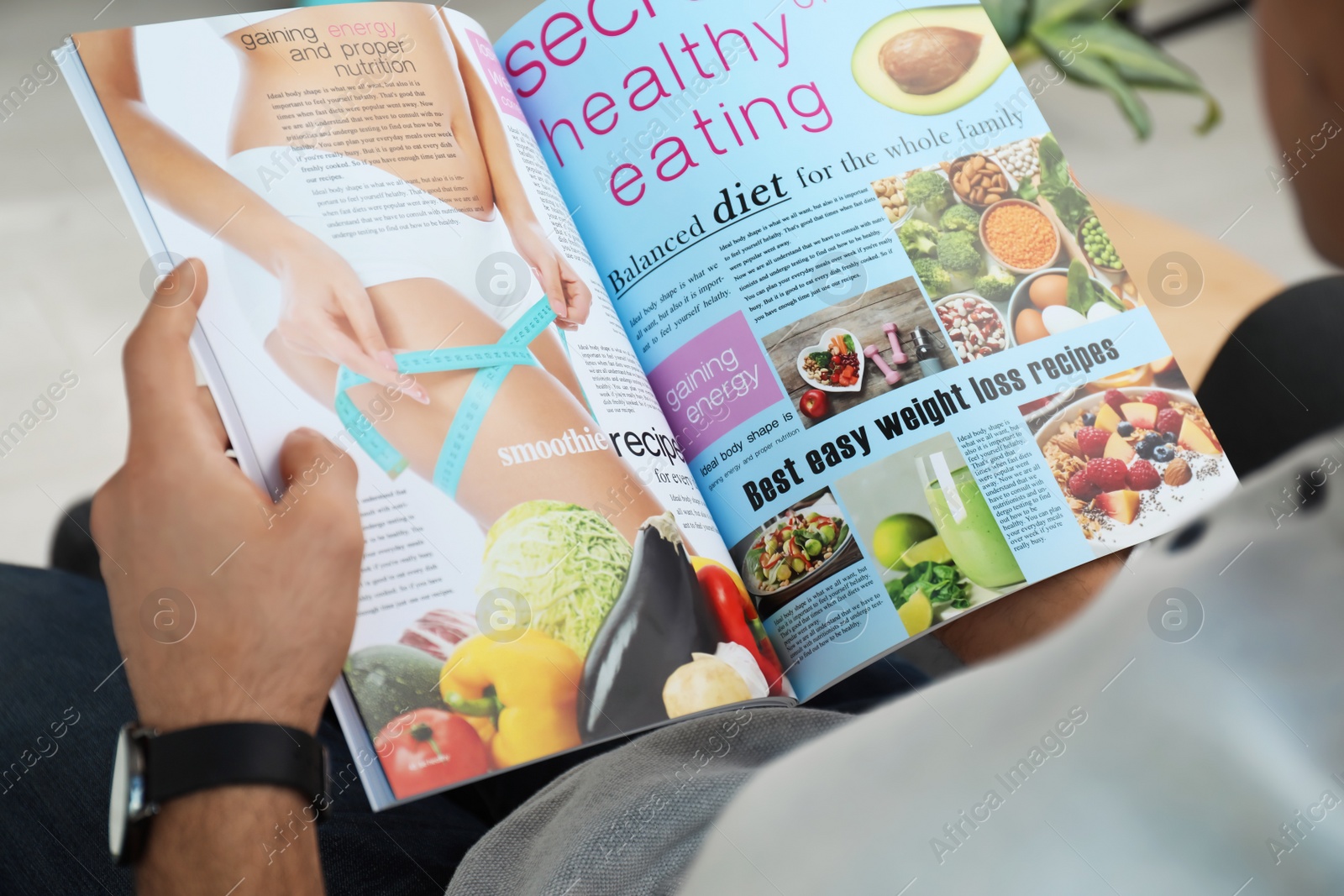 Photo of Man reading healthy food magazine indoors, closeup