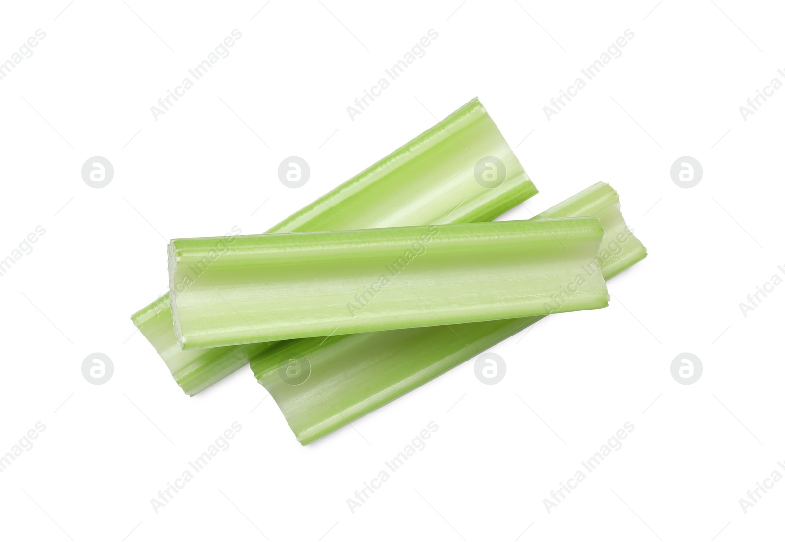 Photo of Fresh green cut celery isolated on white, top view