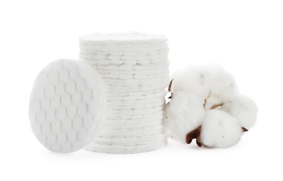 Composition with cotton pads and flower on white background