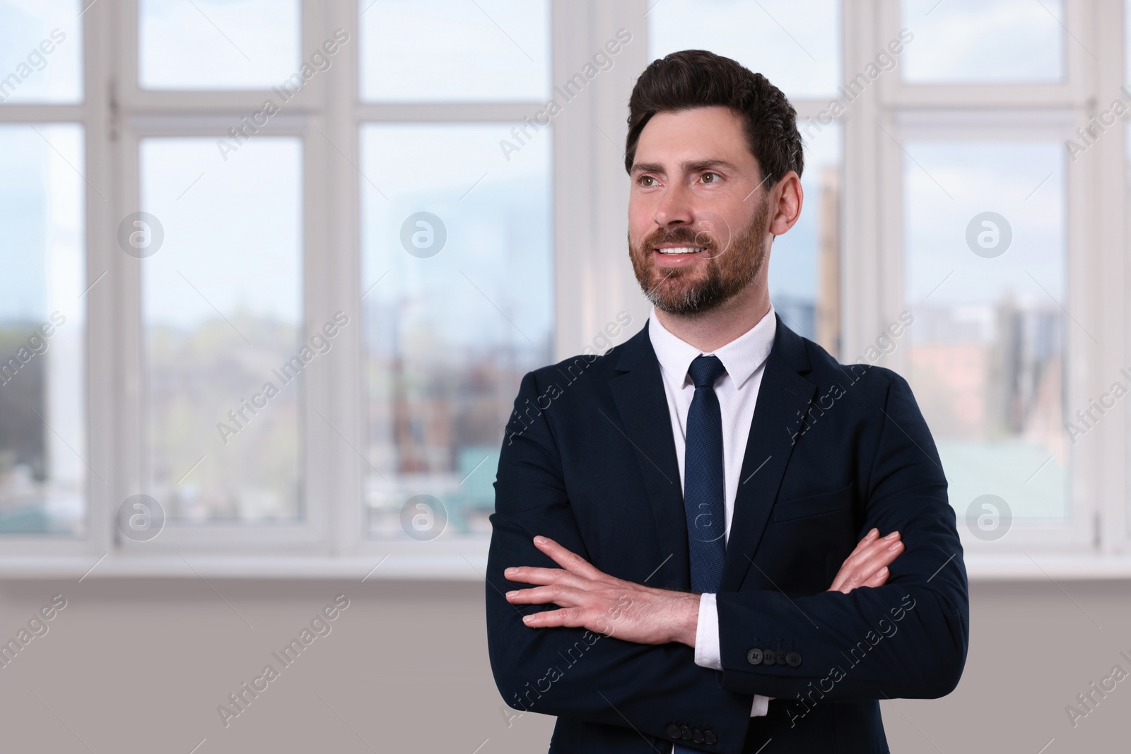 Photo of Happy real estate agent in new apartment. Space for text