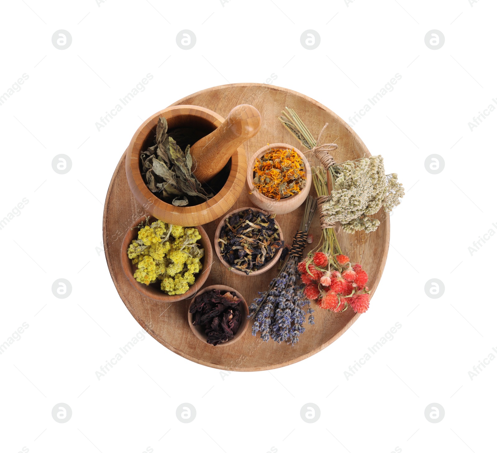 Photo of Mortar with pestle, many different dry herbs and flowers isolated on white, top view