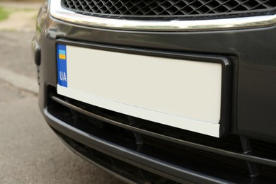 Photo of Car with vehicle registration plate outdoors, closeup