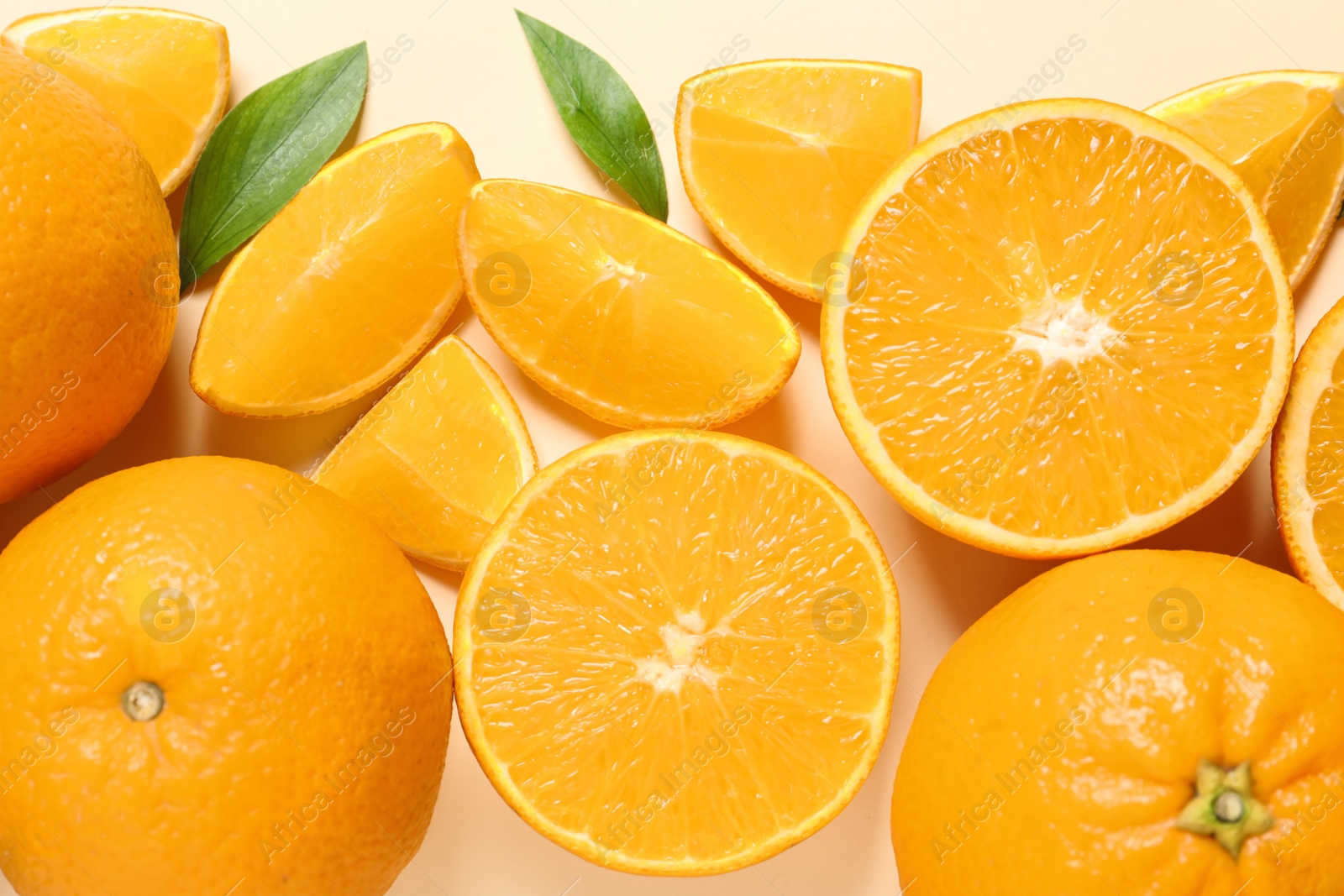 Photo of Flat lay composition with ripe oranges on color background