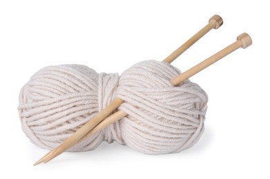 Photo of Soft woolen yarn and knitting needles on white background