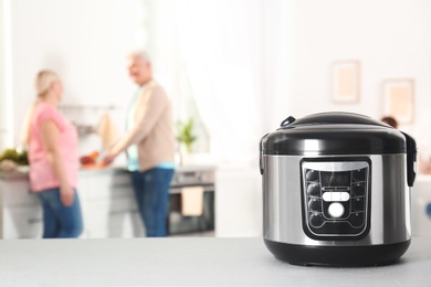 Modern multi cooker on table in kitchen