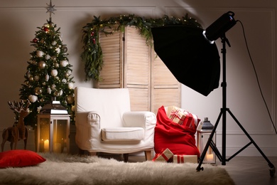 Beautiful Christmas themed photo zone. Cozy living room interior imitation