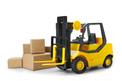 Photo of Toy forklift with boxes isolated on white. Logistics and wholesale concept