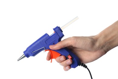 Photo of Woman holding blue glue gun with stick on white background, closeup