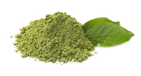 Photo of Pile of green matcha powder and leaves isolated on white