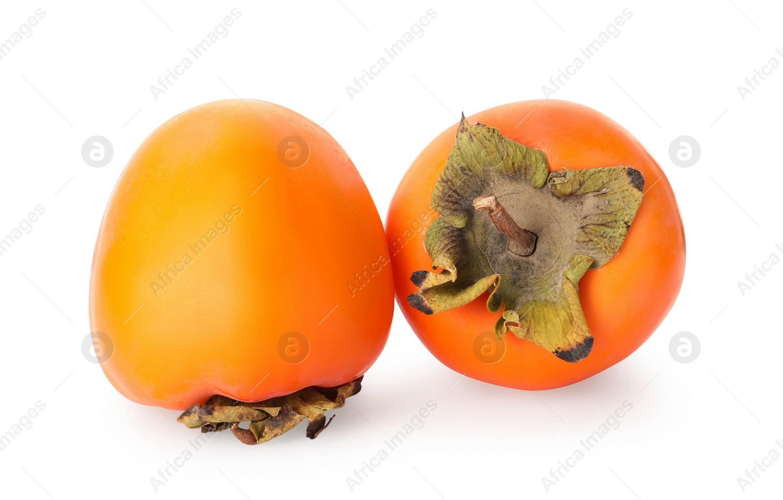 Photo of Delicious ripe juicy persimmons on white background