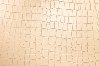 Photo of Beige natural leather as background, top view