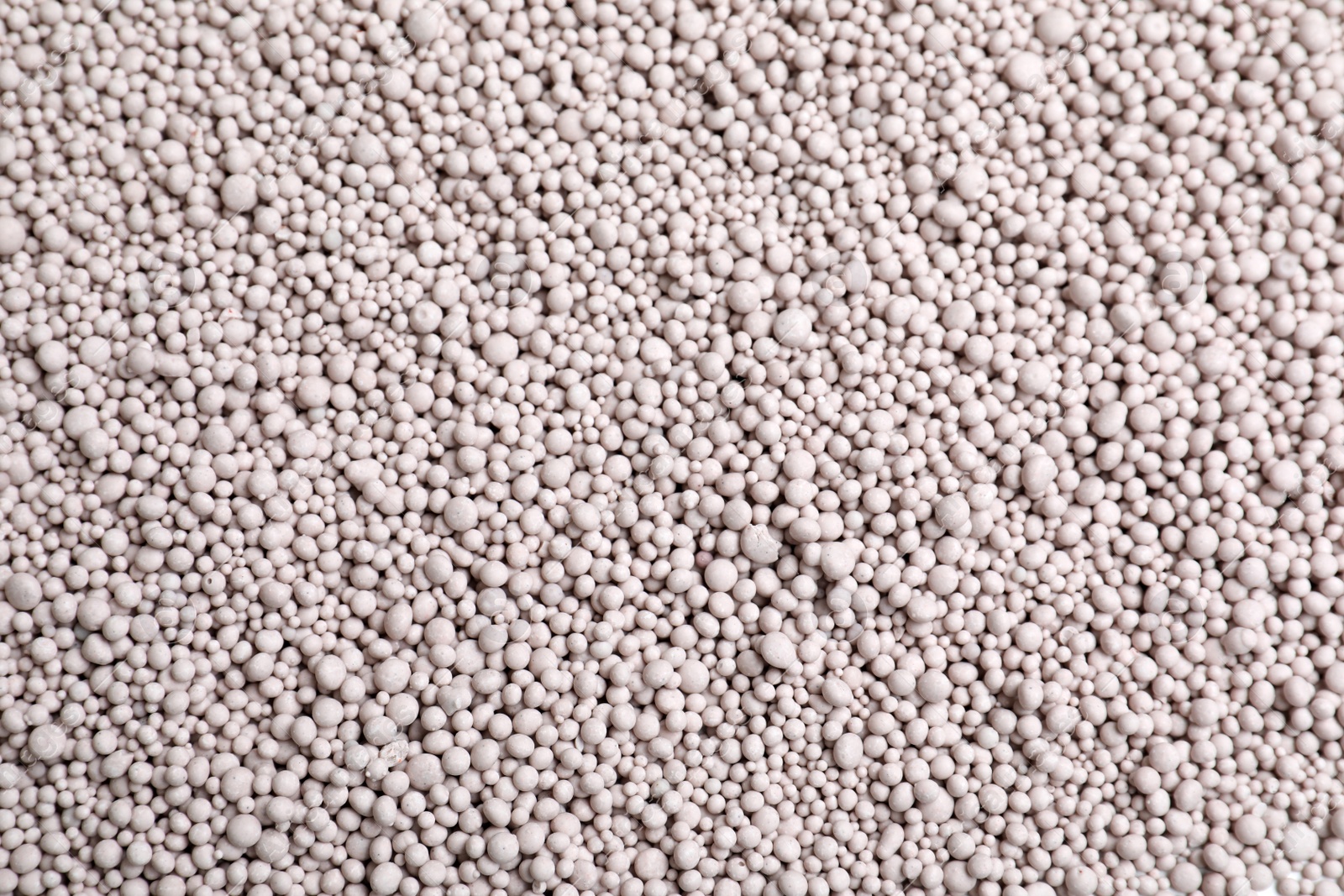 Photo of Textured chemical fertilizer for gardening as background