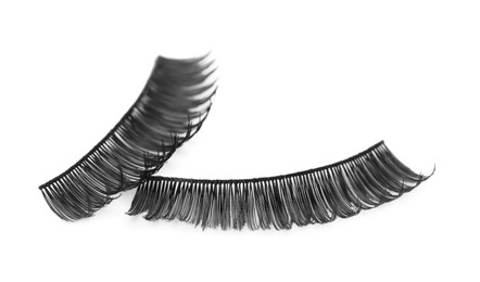 Photo of Fake eyelashes on white background. Makeup product