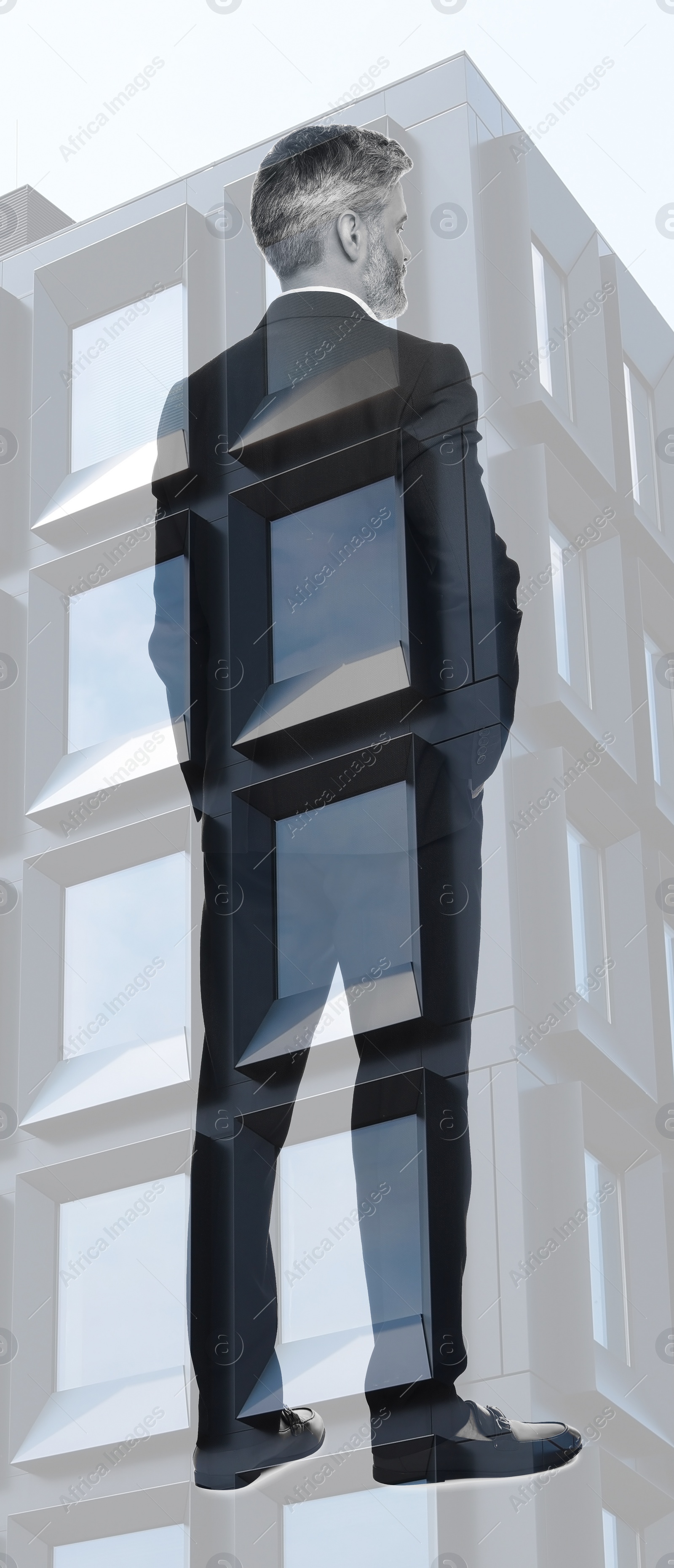 Image of Double exposure of businessman and office building