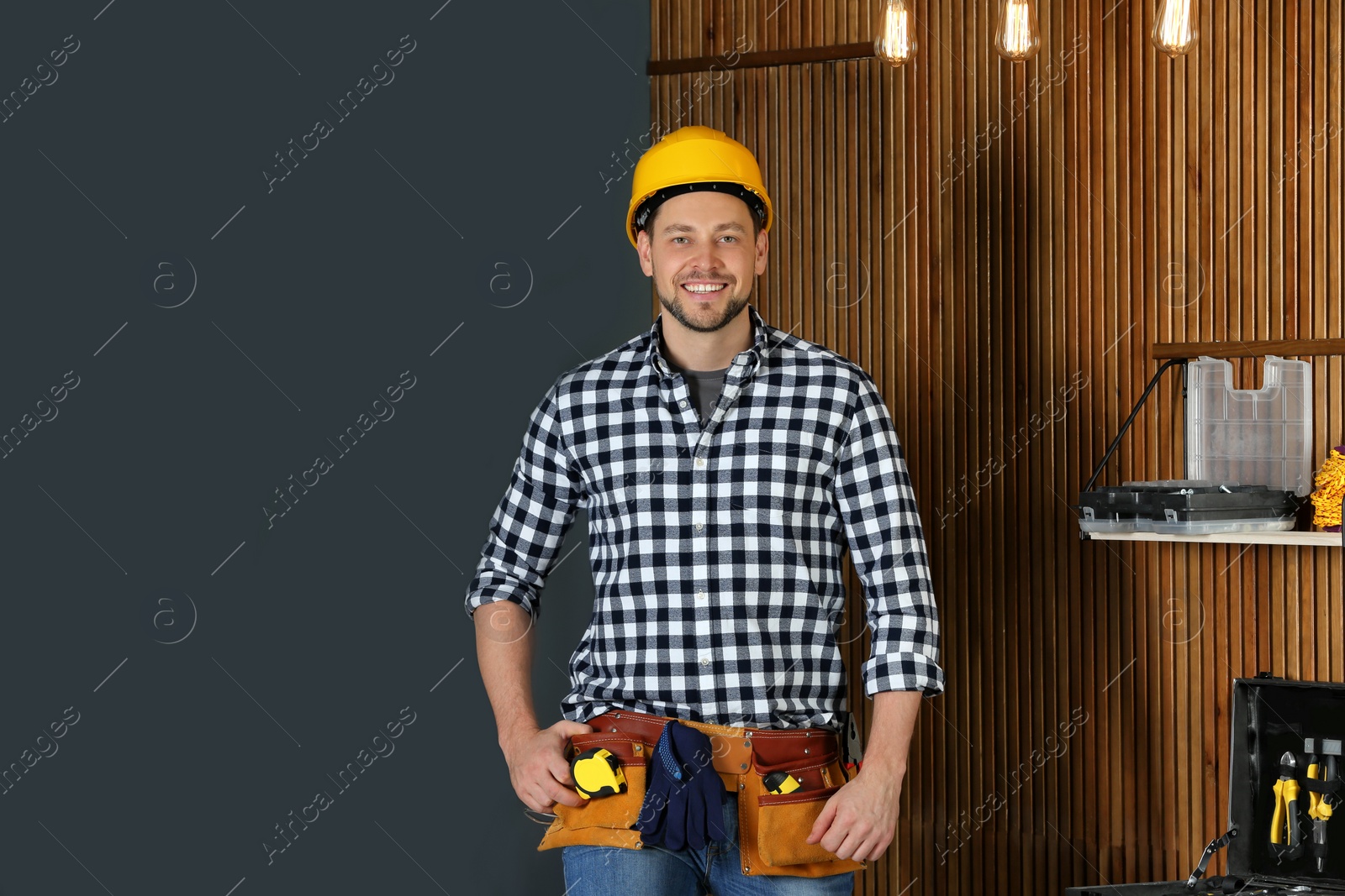Photo of Handsome mature working man in hard hat indoors. Home repair