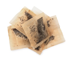 Used tea bags on white background, top view