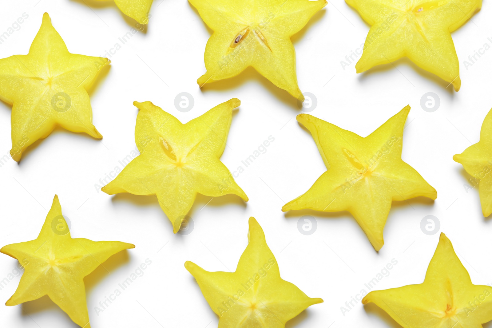 Photo of Slices of delicious carambola on white background, top view