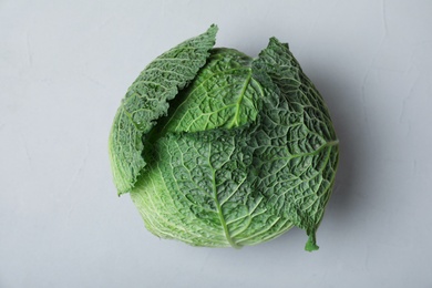 Photo of Savoy cabbage on grey background, top view