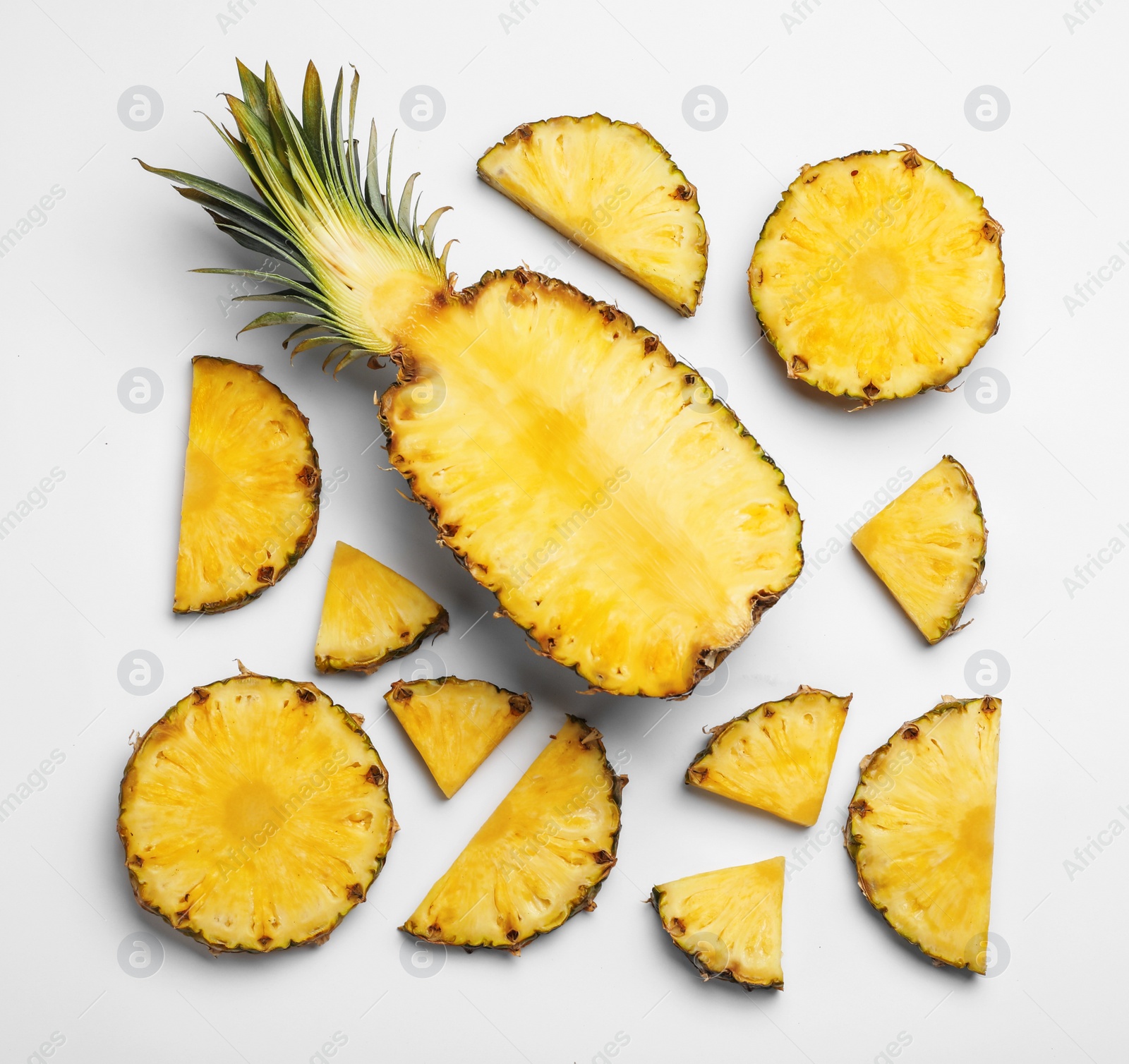Photo of Composition with raw cut pineapple on white background, top view