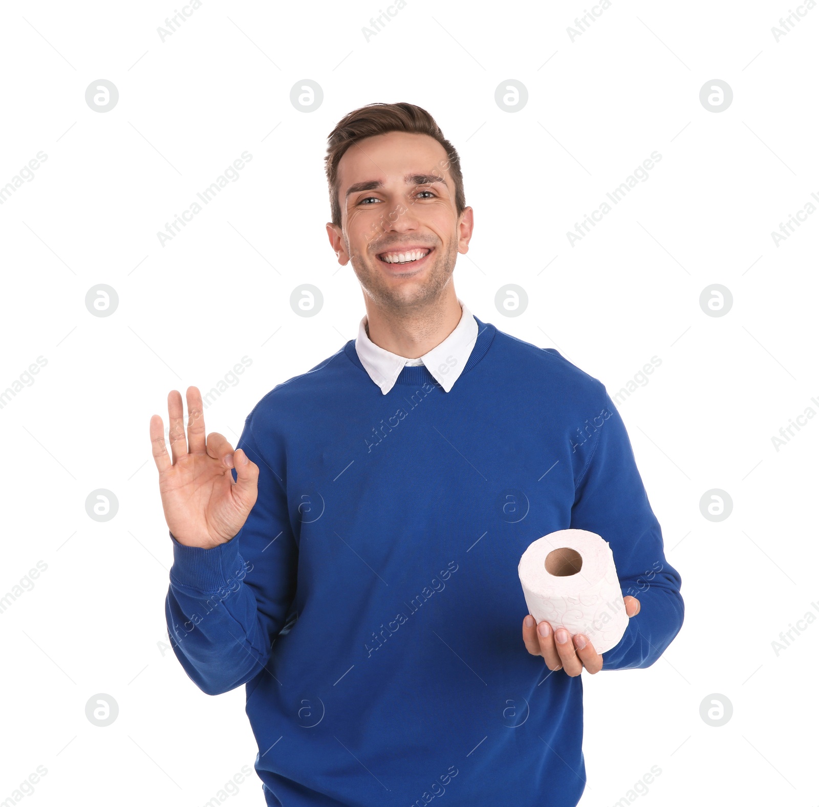 Photo of Young man holding toilet paper roll on white background