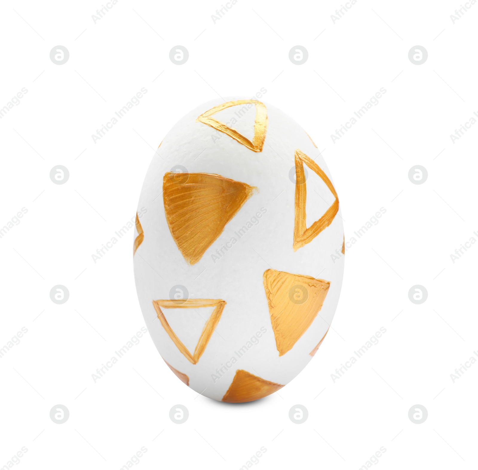 Photo of Traditional Easter egg decorated with golden paint on white background