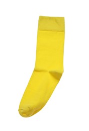 Photo of Yellow sock isolated on white, top view