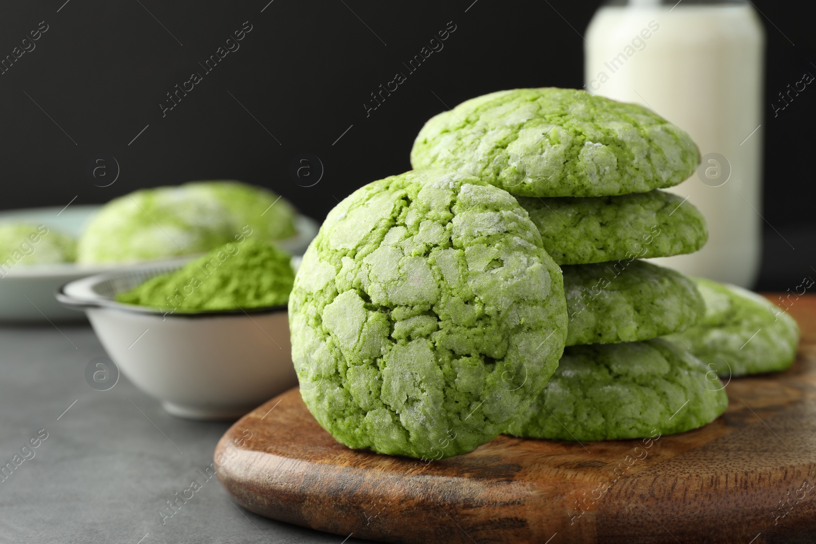 Photo of Tasty matcha cookies on grey table, closeup