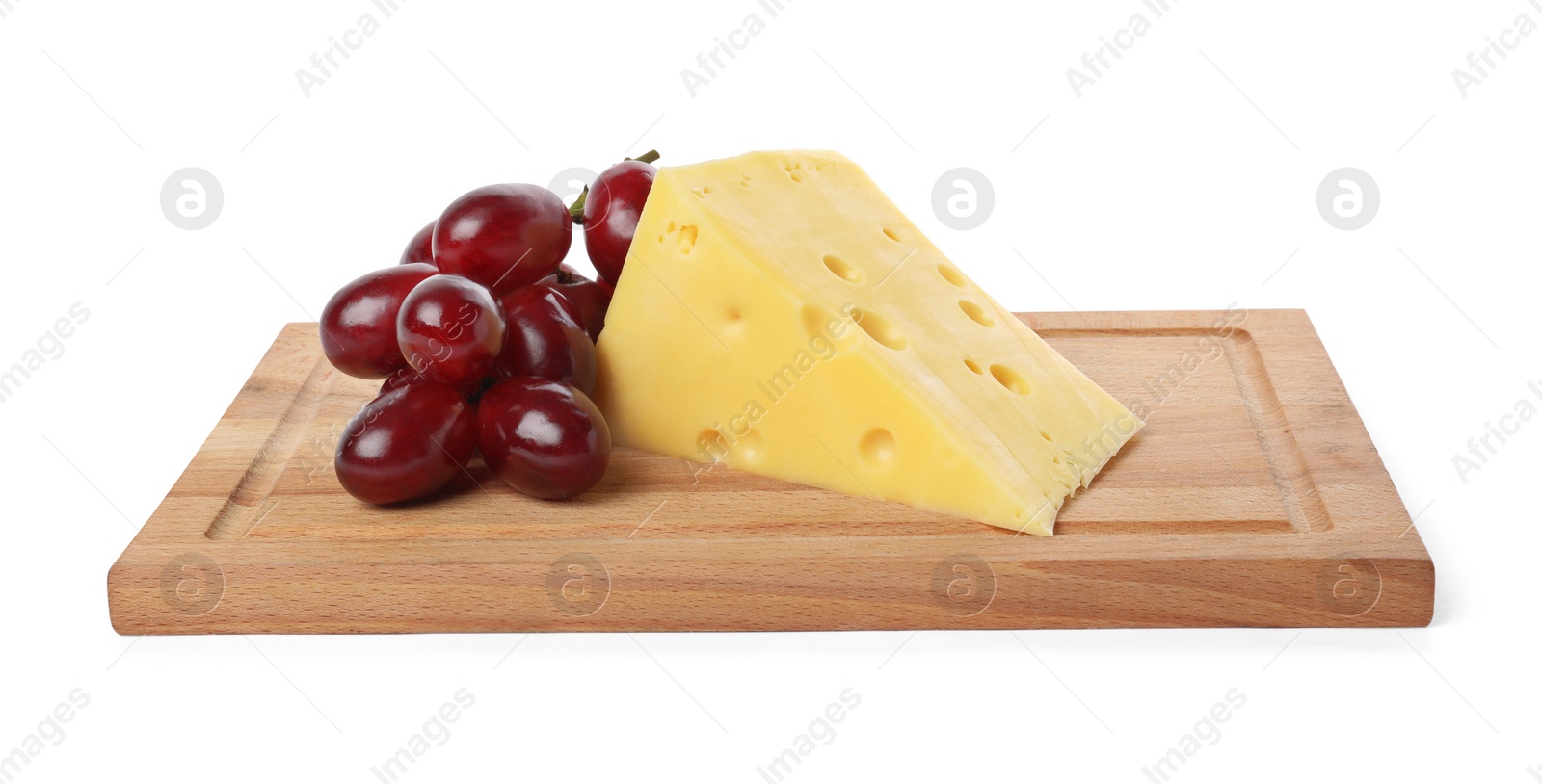 Photo of Piece of delicious cheese and grapes isolated on white