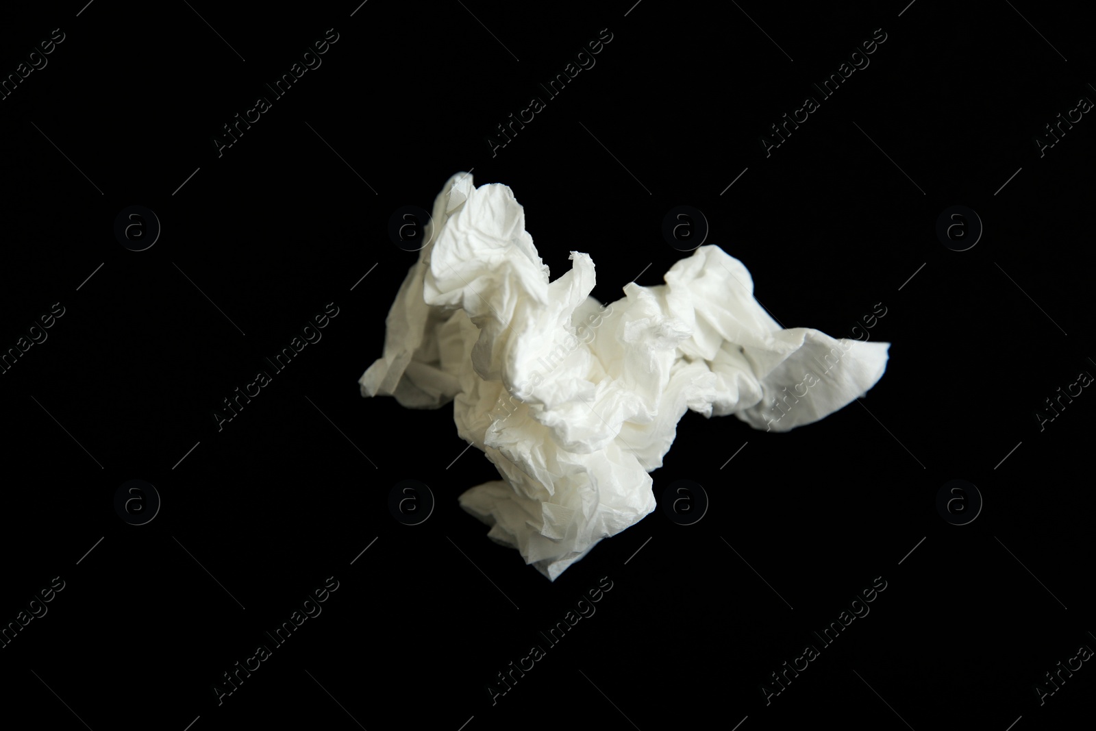 Photo of Used white paper tissue on black background