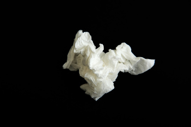 Photo of Used white paper tissue on black background