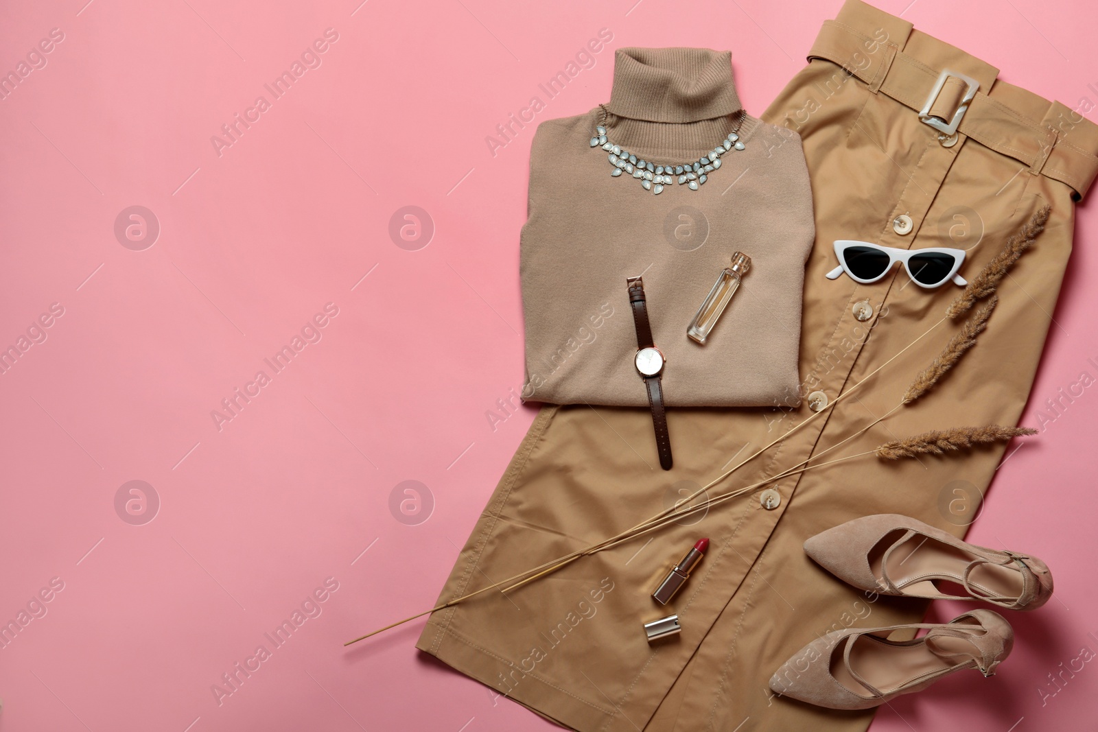 Photo of Stylish shoes, new clothes and accessories on pink background, flat lay. Space for text