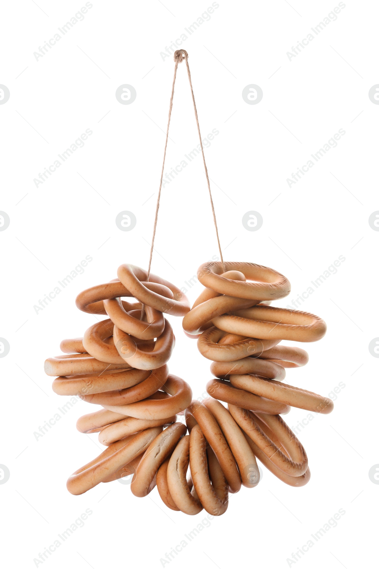 Photo of Bunch of delicious ring shaped Sushki (dry bagels) on white background