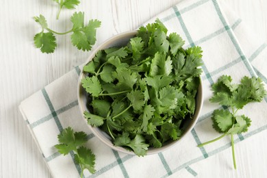 Photo of Fresh aromatic cilantro on white wooden table, flat lay