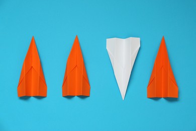 Photo of Flat lay composition with different paper planes on light blue background