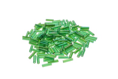 Photo of Pile of green bugle beads on white background