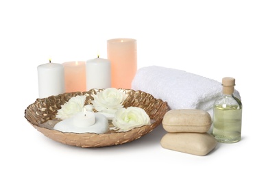 Photo of Beautiful spa composition with candles and flowers on white background