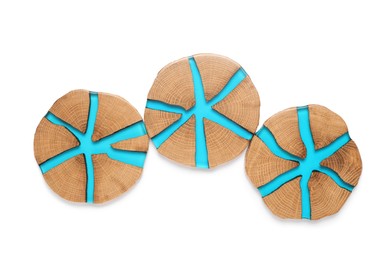 Stylish wooden cup coasters on white background, top view